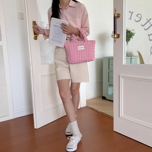 Detail of pink bubble texture tote bag with LOVE SOZAKKA label in lifestyle scene