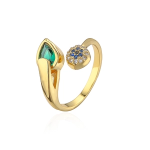 Macro detail of 18K gold plated ring with teardrop green and blue zircon stones