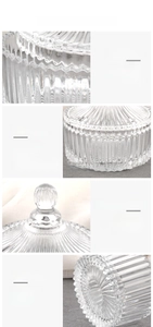 Detail view of ribbed glass storage jar with round lid handle and thick non-slip base