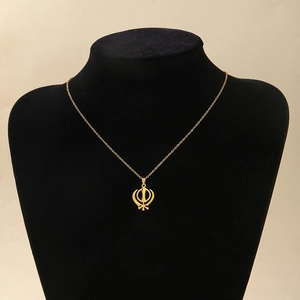 Detailed view of gold Sikh Khanda symbol pendant on cross chain necklace with mirror finish