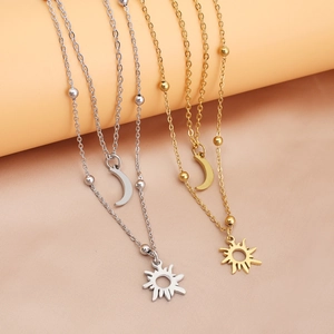 Double-layered gold and silver sun and moon pendant necklaces with polished bead accents