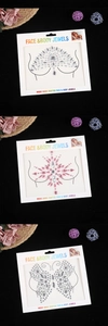 Detailed view of handcrafted silver and pink crystal face and body jewel stickers