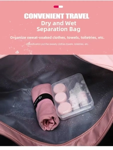 Detail view of pink gym bag interior with dry wet separation waterproof compartment