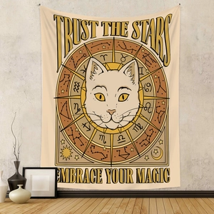 Detail of bohemian cat tapestry with astrology symbols and Trust the Stars text