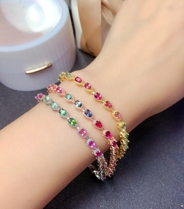 Rainbow gemstone bracelets in gold, silver and rose gold plating on a model wrist