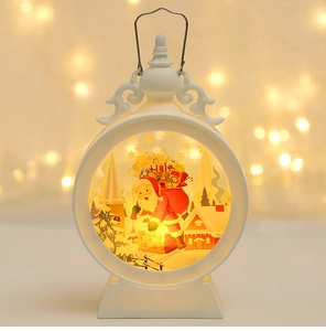 Close-up of white Christmas lantern with warm LED light and festive Santa pattern
