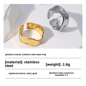 Detailed view of irregular wavy stainless steel rings in gold and silver finish
