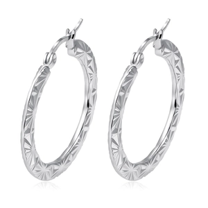 Silver stainless steel hoop earrings featuring engraved starburst patterns on white background