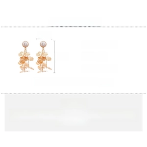 Detailed view of gold multi-layer leaf tassel earrings with white pearls and dimensions