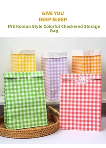 Close-up of thick colorful checkered paper gift bags in assorted vibrant gingham patterns