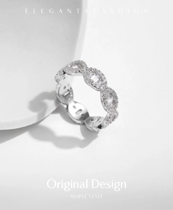 Macro shot of S925 sterling silver ring with pavé diamonds and rectangular stones