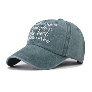 Vintage washed dark green baseball cap featuring white script embroidery text on front