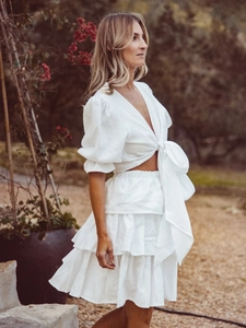 White two-piece set with puff sleeve tie-front crop top and layered tiered cake skirt