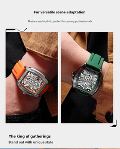 Detail view of tonneau mechanical skeleton watches with vibrant silicone straps on wrist