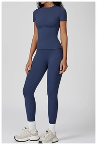 Close-up of slim-fit navy blue brushed yoga set with high-waist leggings and short sleeves