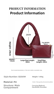 Detailed view of woven crescent shoulder bag with size dimensions in wine red PU leather