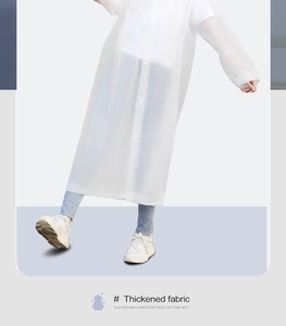 Detail view of the thickened waterproof EVA fabric on this long hooded white raincoat