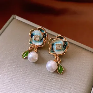 Elegant floral pearl earrings with blue gradient enamel petals and zircon stone inlay