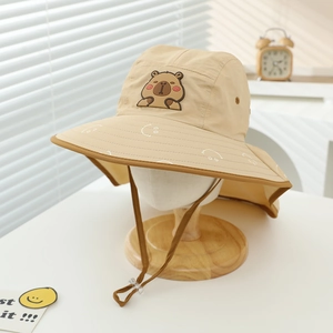 Detail of kids sun hat with Capybara rubber patch, neck flap and wide brim for outdoors