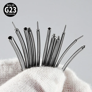 Close-up of G23 solid titanium piercing taper needles and threaded metal insertion tools