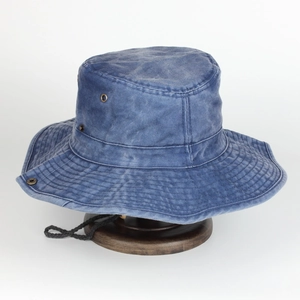 Detail of navy washed cotton bucket hat with vent holes and adjustable wind rope