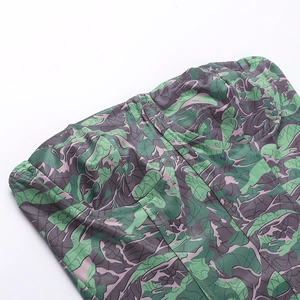 Close-up of green leaf print corset top showing fine fabric texture and stitching details