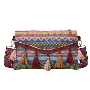 Ethnic bohemian woven crossbody bag with colorful tassels and wide printed strap