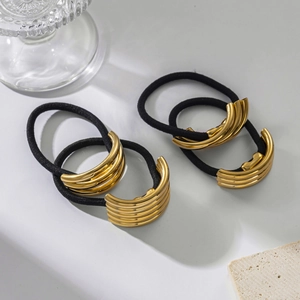 Set of minimalist black elastic hair ties with polished gold layered metal accents
