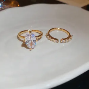 Elegant 2-piece gold zircon ring set with oval solitaire and pavé bands for women