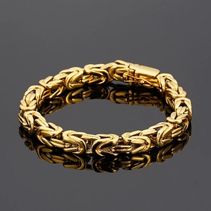 Close-up of golden 18K stainless steel Byzantine chain bracelet with folding clasp