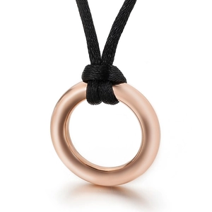Minimalist round rose gold pendant on a black cord necklace with a sleek polished finish