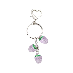 Translucent purple strawberry keychain charms with silver heart clasp on white background