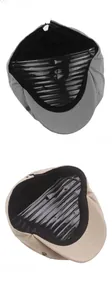 Detailed view of sun protection newsboy hat lining and reinforced metal rivets