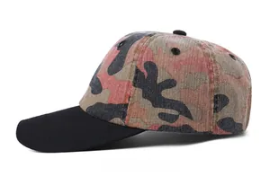 Side view detail of a pink camo baseball cap featuring a black brim and twill texture
