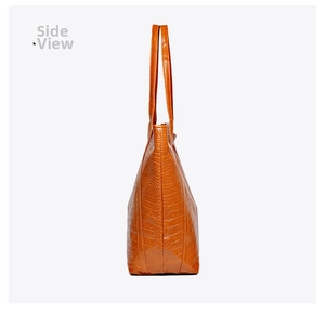 Side view of brown crocodile texture tote bag with premium leather finish and long straps