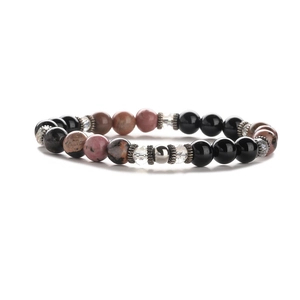 Elastic beaded bracelet with natural white pine and pink stones featuring metal spacers
