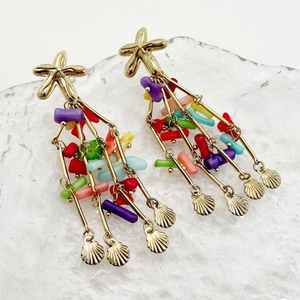 Macro shot of bohemian seashell starfish earrings with colorful beaded tassels