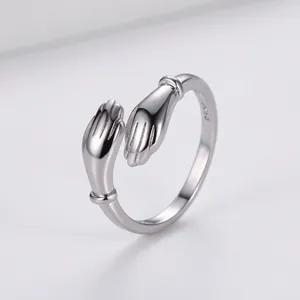 Polished S925 sterling silver open ring featuring a unique hugging hands design motif