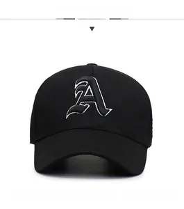 Detailed close-up of a black cotton baseball cap featuring white embroidered letter A