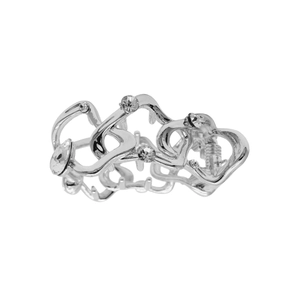 Detail of silver wavy metal hair claw clip with sparkling rhinestones and hollow design