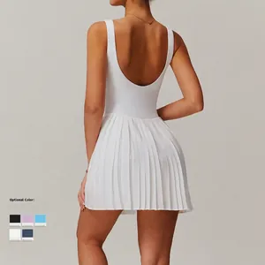 White backless pleated tennis dress with shorts and pockets for fitness and sports