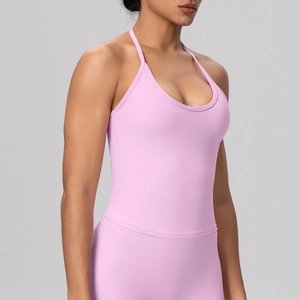 Detail of light pink high-stretch halter yoga bra with thin straps and U-neckline