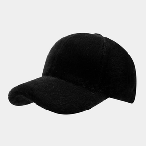 Close-up of the plush faux fur texture and stitching on the black winter baseball cap