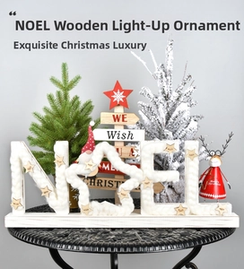 Detail of illuminated wooden NOEL letter sign with white plush trim and stars decoration