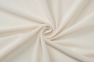 Macro shot of beige mesh knit fabric texture and soft material weave for a sexy two-piece set