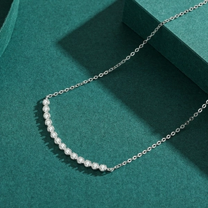 Elegant S925 sterling silver necklace with curved sparkling zircon bar on green pedestal
