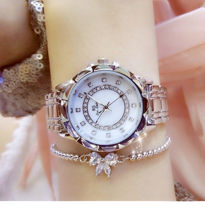 Silver metal women's watch with rhinestone bezel and matching bow bracelet set