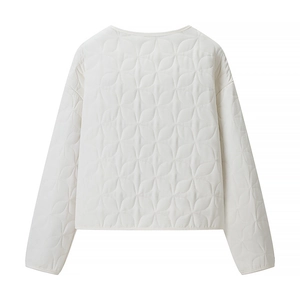 Rear view of white quilted jacket showing intricate petal-shaped stitching details