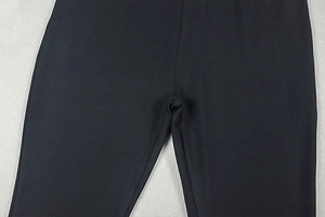 Close-up of durable reinforced crotch stitching on black seamless athletic jumpsuit
