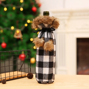 Christmas buffalo plaid wine bottle cover with white faux fur trim and black silk ribbons